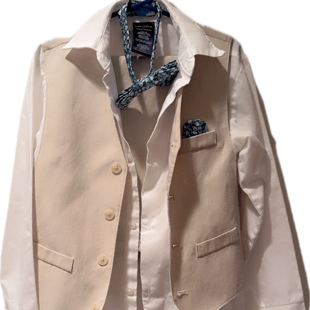 Boys Nautica Cream Vest with White Shirt and Blue Patterned Tie ankle out pants